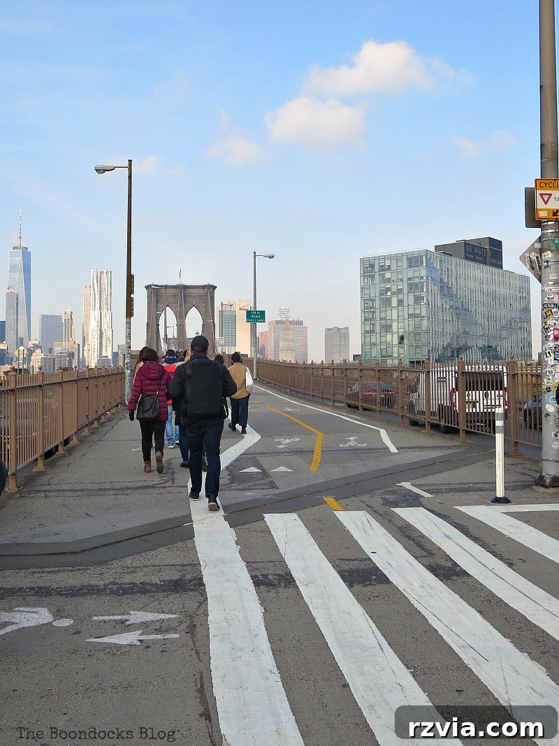 The official entrance to the Brooklyn Bridge walkway from the Brooklyn side, marking the end of a memorable journey. A Tour of the Astonishing Brooklyn Bridge Walkway.