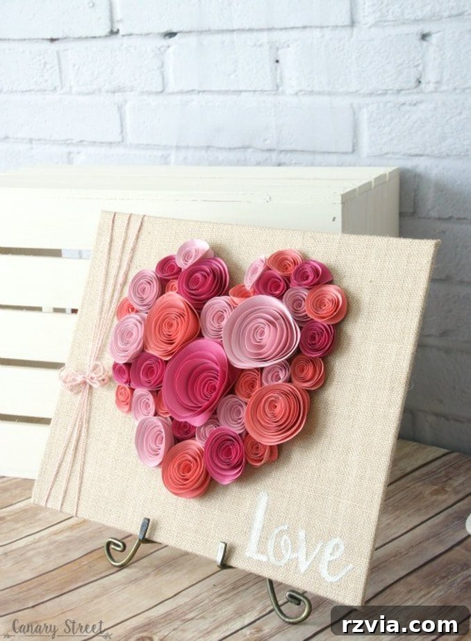 Beautiful spiral paper flowers arranged into a heart shape, a versatile DIY Valentine's Day craft or year-round decor.