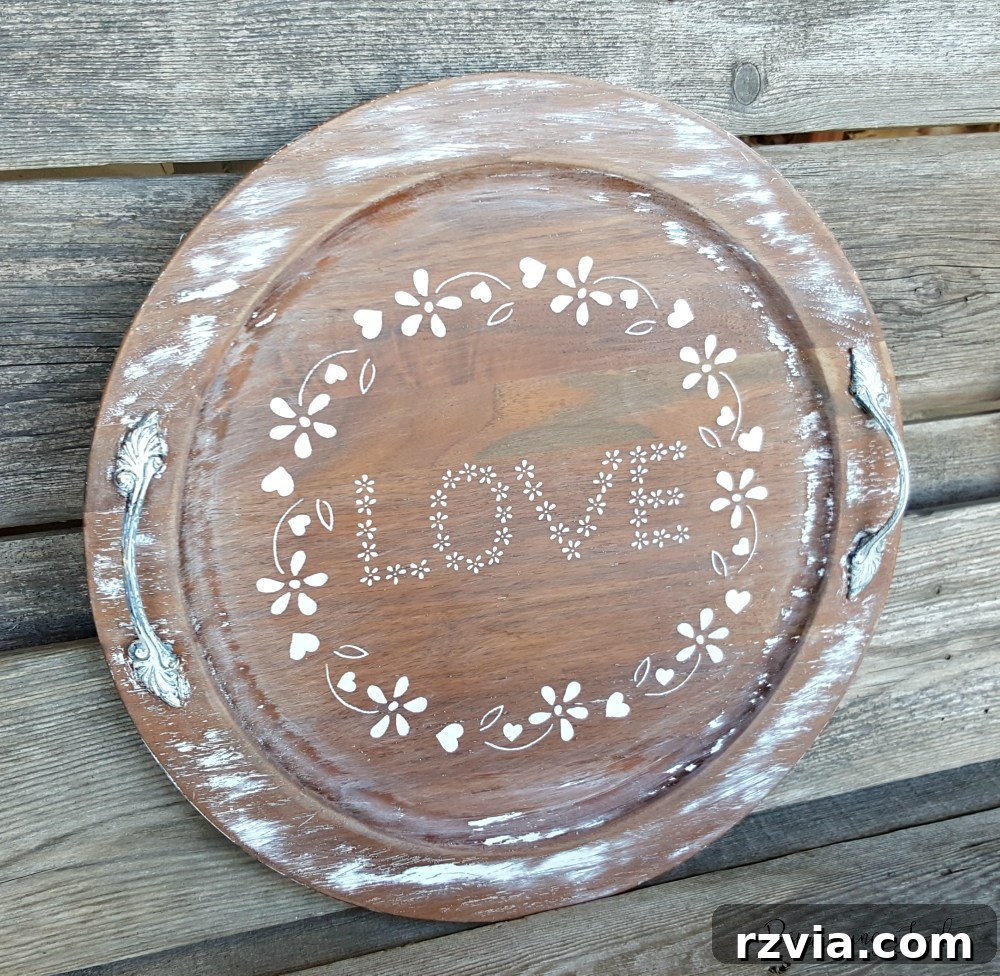 Rustic wall decor made from a repurposed wooden tray with stenciled designs, ideal for Valentine's Day and year-round display.