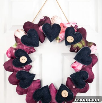 Charming Valentine's Day craft: a DIY wreath adorned with colorful scrap fabric hearts, perfect for festive decor year-round.