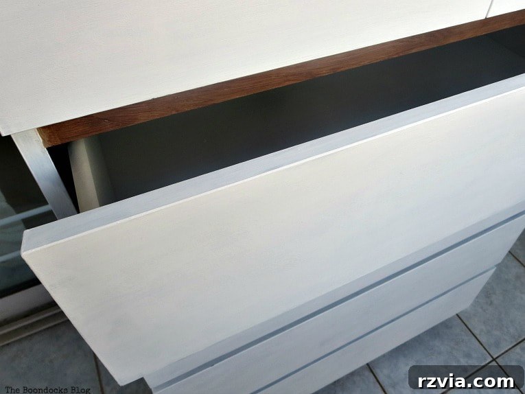Stunning Black Ikea Malm Dresser Makeovers 16 The front of the dresser with its drawers painted white and sealed, showcasing the refreshed look.