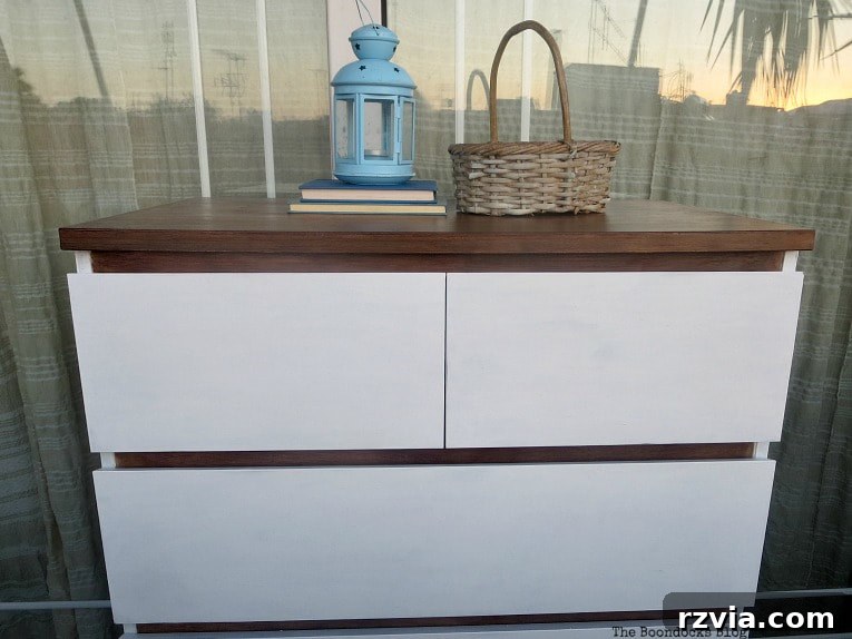 Stunning Black Ikea Malm Dresser Makeovers 20 The finished dresser styled with a woven basket, a blue lantern, and two books on its durable top surface.