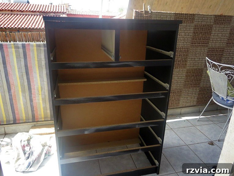 Stunning Black Ikea Malm Dresser Makeovers 4 Drawers from the dresser have been removed, and the sanding process has begun to prepare the surface for painting.