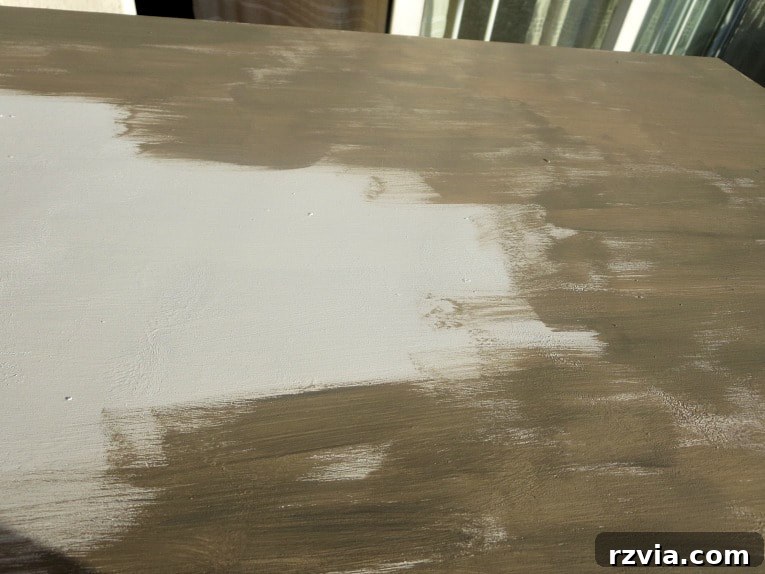 Stunning Black Ikea Malm Dresser Makeovers 8 Painting the top of the dresser with the custom-mixed brown color, using short brush strokes for texture.