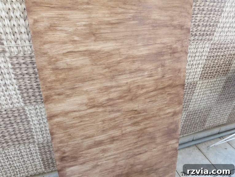 Table top after gel stain application in the same direction as the base paint.