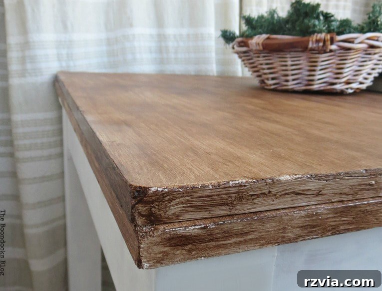 Close-up of the finished table surface showing the distressed, worn look.