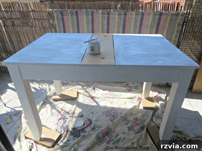 Close-up of table top painted with chalk paint against the grain.