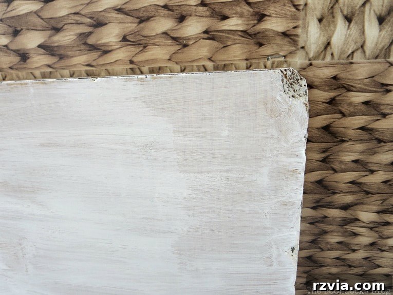 Laminate table top with chalk paint applied, highlighting a repaired edge.