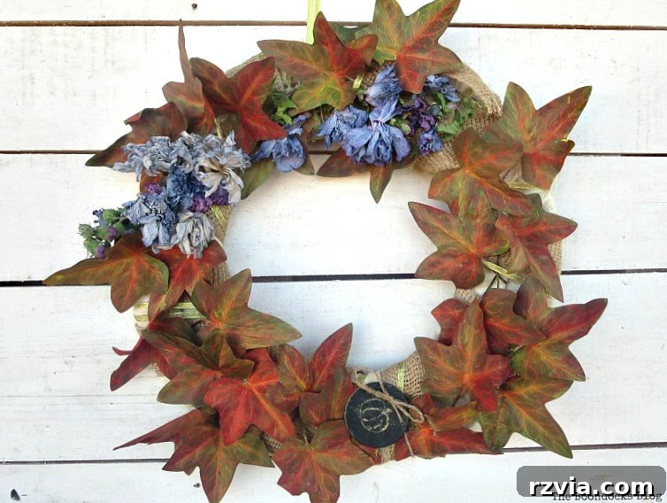 Dollar Store Vine Transformed into a Gorgeous Fall Wreath 13 The fall wreath with painted plastic vines and dried flowers, awaiting further embellishments.