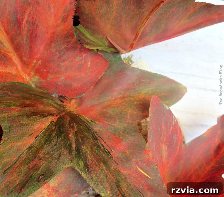 Dollar Store Vine Transformed into a Gorgeous Fall Wreath 9 Painted vines carefully tucked under the burlap ribbon on the wreath base, securing the leaves for the DIY fall wreath.