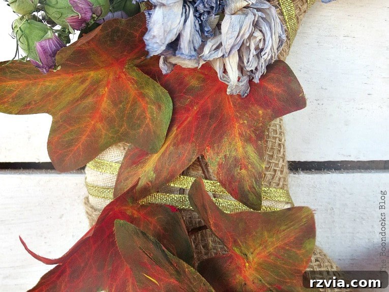 Dollar Store Vine Transformed into a Gorgeous Fall Wreath 10 Gold ribbon wrapped around the fall wreath, adding sparkle and securing the leaves further.