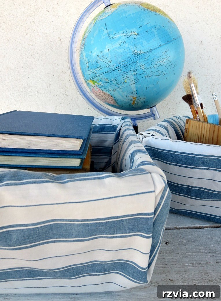Fabric Fix: Giving New Life to Old Plastic Baskets 14 A wider shot showcasing the fabric-wrapped plastic baskets filled with books and art supplies, enhancing a desk area next to a globe.