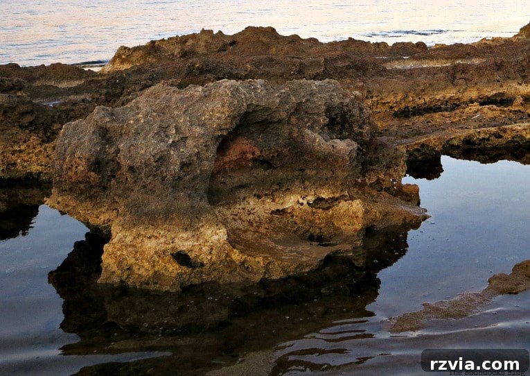 Kefalonia's Rugged Beauty: Where Brown Rocks Meet the Sea 12 Dramatic rocks at dusk, bathed in the soft, fading light on Kefalonia, Greece
