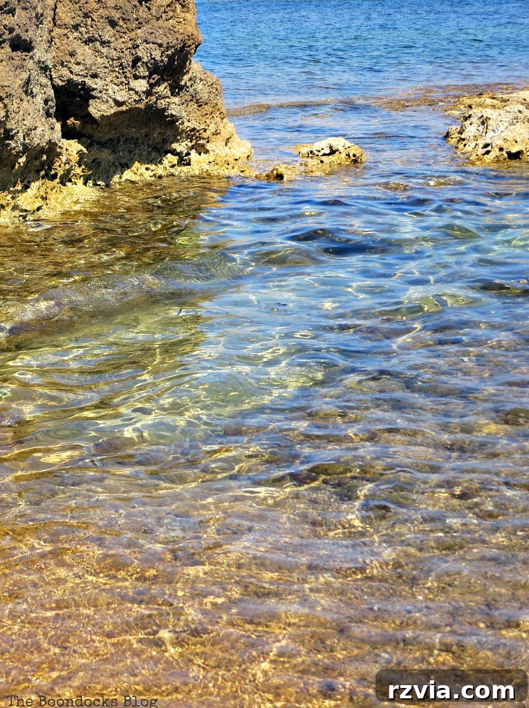 Kefalonia's Rugged Beauty: Where Brown Rocks Meet the Sea 14 Remarkably crystal clear waters of Kefalonia, inviting serene immersion and exploration