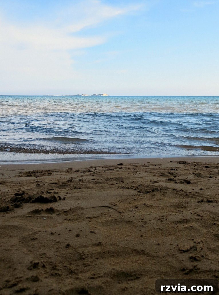 Kefalonia's Rugged Beauty: Where Brown Rocks Meet the Sea 15 Abstract view of light blue sky, dark blue water, and brown sand, reminiscent of a Rothko painting in Kefalonia, Greece
