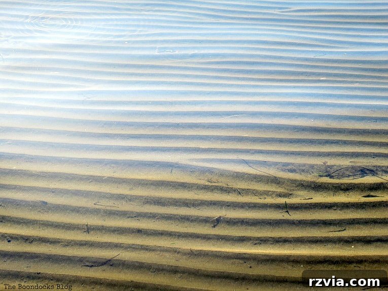 Kefalonia's Rugged Beauty: Where Brown Rocks Meet the Sea 3 Mesmerizing rippling sand patterns under unbelievably clear water, Kefalonia, Greece