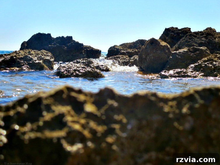 Kefalonia's Rugged Beauty: Where Brown Rocks Meet the Sea 4 Striking contrast of azure water and sky against rugged brown rocks, Kefalonia coastline