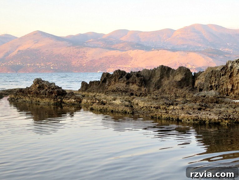 Kefalonia's Rugged Beauty: Where Brown Rocks Meet the Sea 8 Golden sunset light illuminates ancient rocks on Kefalonia coast, Greece