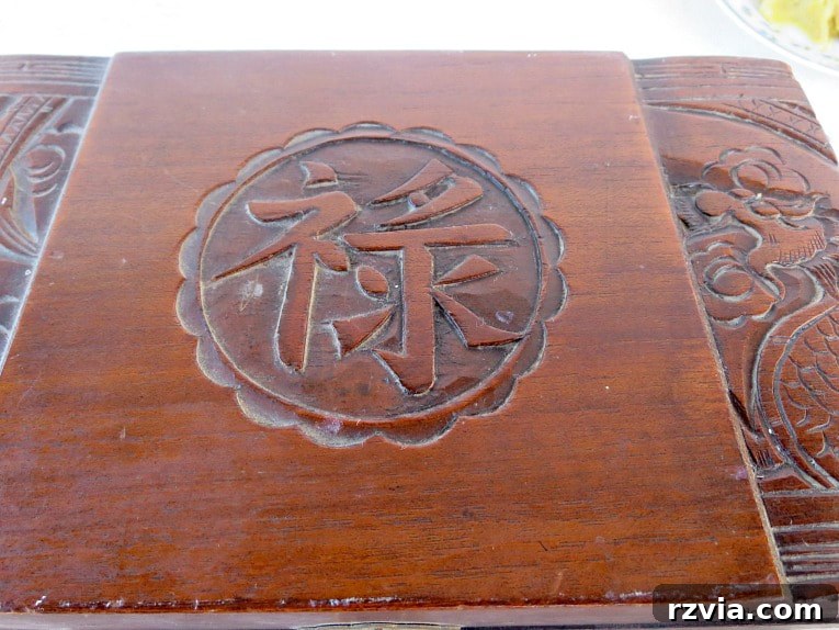 Craft Your Own Natural Beeswax Furniture Polish 11 Wooden box showing the left un-waxed side and the right waxed side.