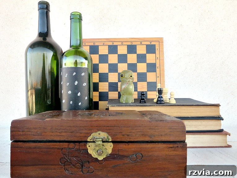 Craft Your Own Natural Beeswax Furniture Polish 14 Polished wooden box placed with books, a chess set, chess pieces and empty wine bottles.