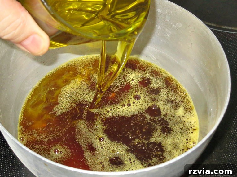 Craft Your Own Natural Beeswax Furniture Polish 8 Adding olive oil to the melted beeswax.