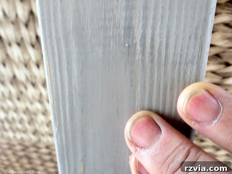 Elevate Your IKEA Hejne Shelf With A Fresh Coat Of Paint 13 Adding wax to the painted wood.