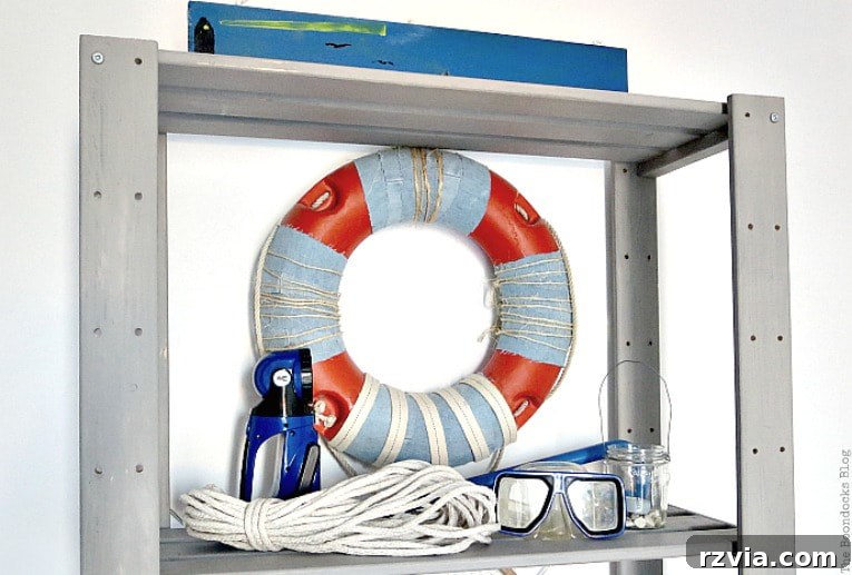 Elevate Your IKEA Hejne Shelf With A Fresh Coat Of Paint 3 top part of Ikea Hejne shelf painted and decorated with a life saver.