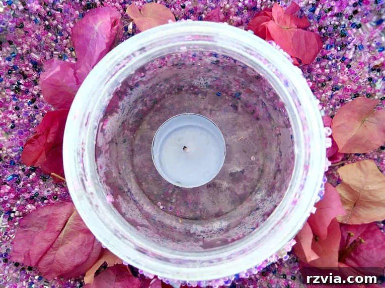 Copper Pot Upcycling Nightmares 18 Beaded lantern with dried flowers and a tea light, showcasing the final decorative touch