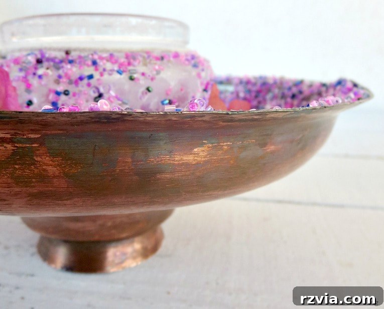 Copper Pot Upcycling Nightmares 19 Side view of copper lid with beads, demonstrating its durability on a windy balcony