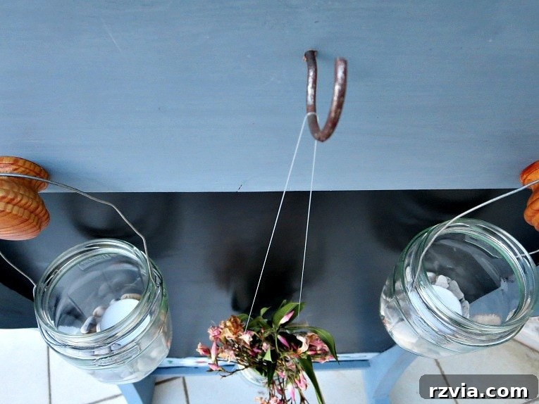 Vintage Chalkboard Stand Reimagined 13 A rustic metal hook installed in the center of the upcycled chalkboard stand for additional hanging options. How to Give New Life to a Chalkboard Stand www.theboondocksblog.com