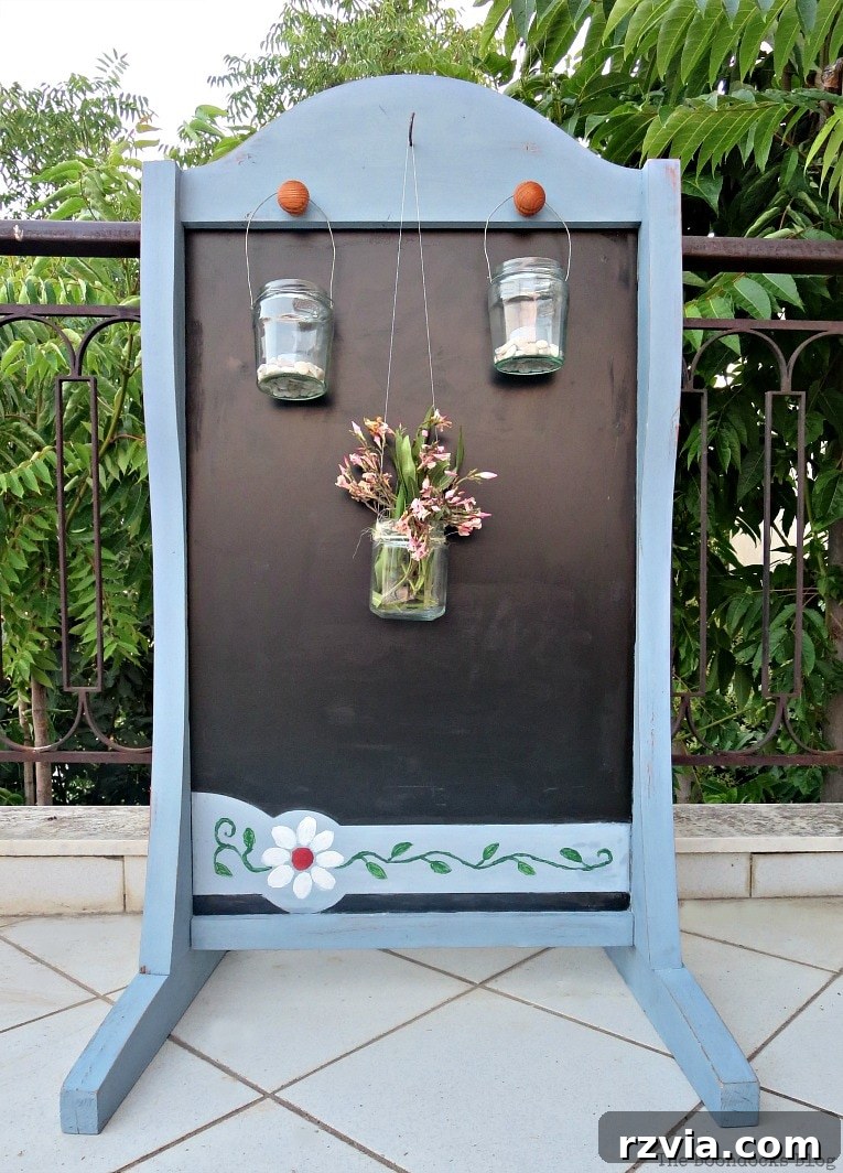 Vintage Chalkboard Stand Reimagined 14 One side of the upcycled chalkboard stand, featuring hanging tea light lanterns and the refreshed blue paint. How to Give New Life to a Chalkboard Stand www.theboondocksblog.com