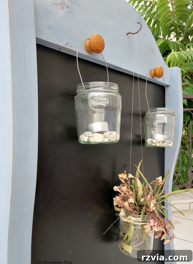 Vintage Chalkboard Stand Reimagined 15 Close-up of hanging lanterns on the newly upcycled chalkboard stand, showcasing outdoor ambiance. How to Give New Life to a Chalkboard Stand www.theboondocksblog.com
