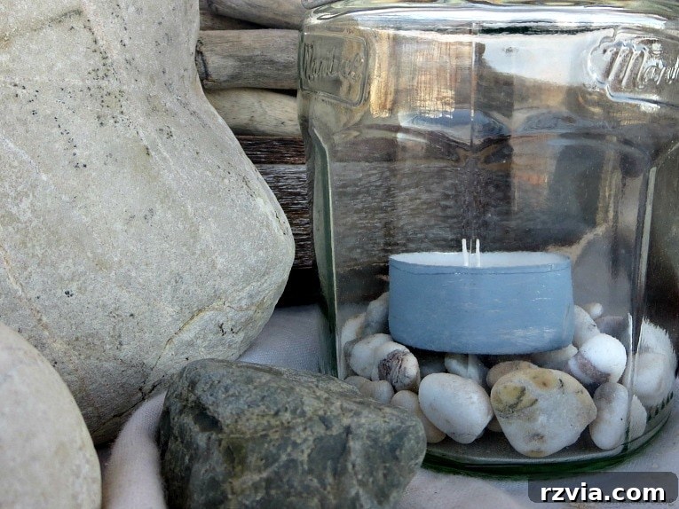 Transform Jars into Glowing Lanterns 17 A painted tea light candle nestled inside a lantern jar, highlighting an easy craft for repurposed jars to create beautiful tealight lanterns and DIY lantern lights.