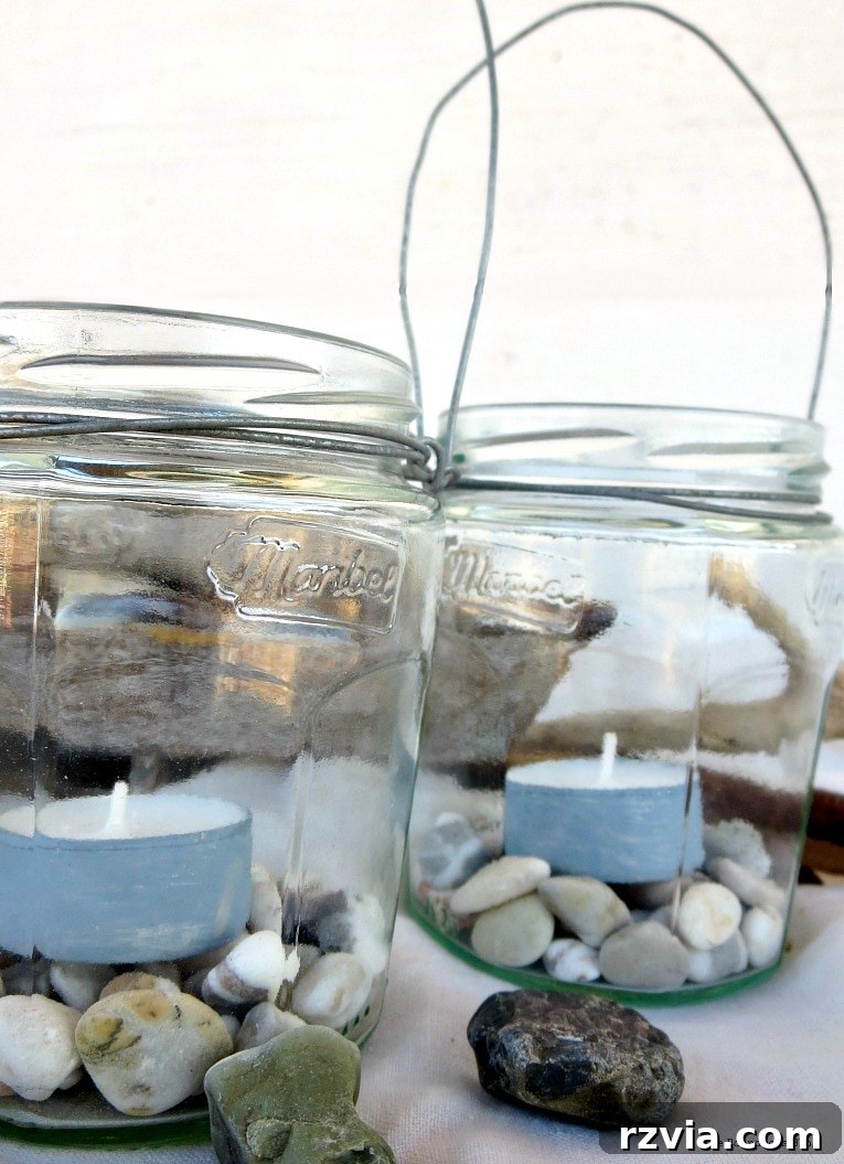 Transform Jars into Glowing Lanterns 18 Two beautifully adorned lantern jars with tea lights and pebbles inside, illustrating an easy craft from repurposed jars for elegant tealight lanterns and DIY outdoor lights.