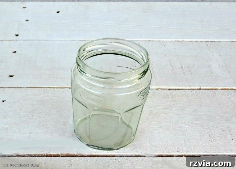 Transform Jars into Glowing Lanterns 3 A marmalade jar ready for repurposing into a beautiful DIY lantern, showcasing the potential of simple glass jars for crafting elegant home decor.