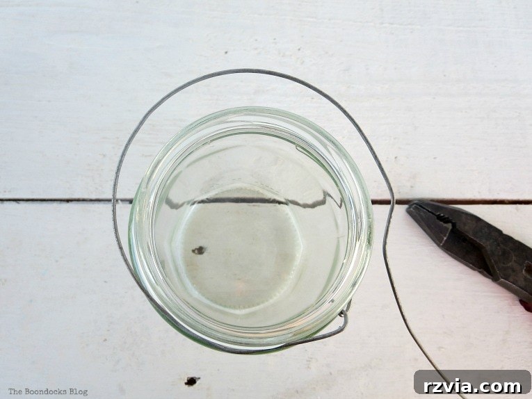 Transform Jars into Glowing Lanterns 10 A top-down view showing the second circular wire wrap around the outer rim of the jar, providing enhanced stability for the lantern's structure.
