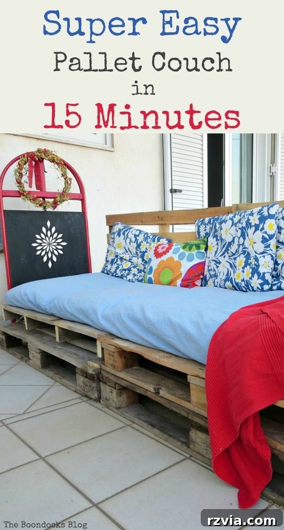 A completed DIY pallet couch covered with colorful cushions and blankets. How to make a super easy pallet couch using pallets and rope. Quick and easy without breaking the bank, #palletcouch #palletseating #outdoorseating #easyoutdoorfurniture #palletfurniture #DIYfurniture #easypalletcouch. A completed DIY pallet couch covered with colorful cushions and blankets.