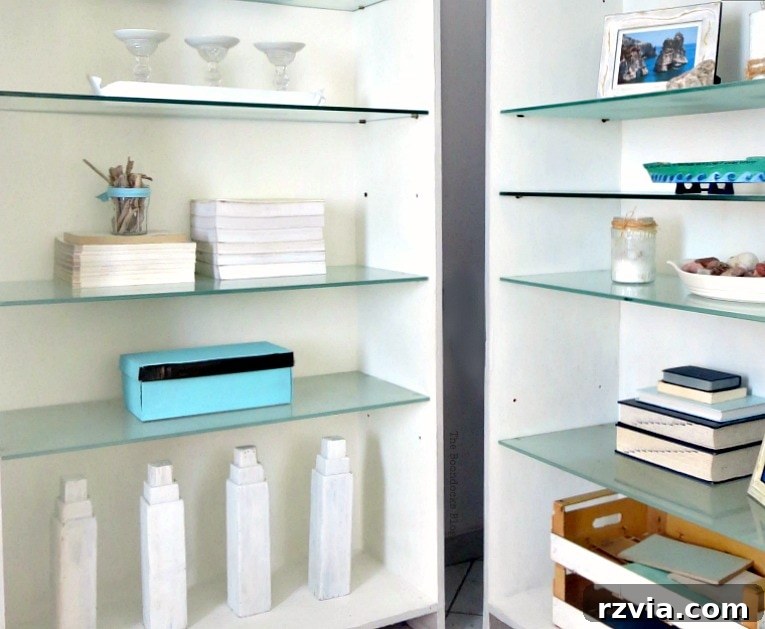 Upcycled Bookcases: Crafting Success, Avoiding Pitfalls 13 Elegantly styled bookcases featuring blue and white accessories, creating a cohesive beachy nautical theme.