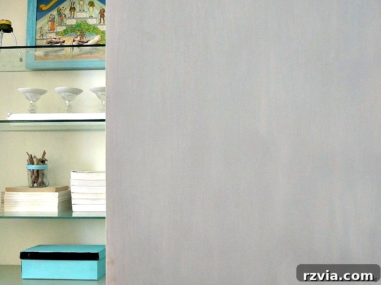 Upcycled Bookcases: Crafting Success, Avoiding Pitfalls 18 The grey exterior of the upcycled bookcase, showing subtle variations in paint application for added texture.