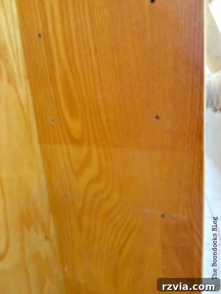 Upcycled Bookcases: Crafting Success, Avoiding Pitfalls 4 Close-up of the bookcase's side, revealing clear discoloration and varied shades on the surface.