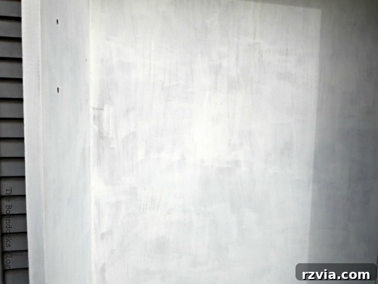 Upcycled Bookcases: Crafting Success, Avoiding Pitfalls 8 The second coat of paint on the interior of the bookcase, showing improvement but still not fully satisfactory.