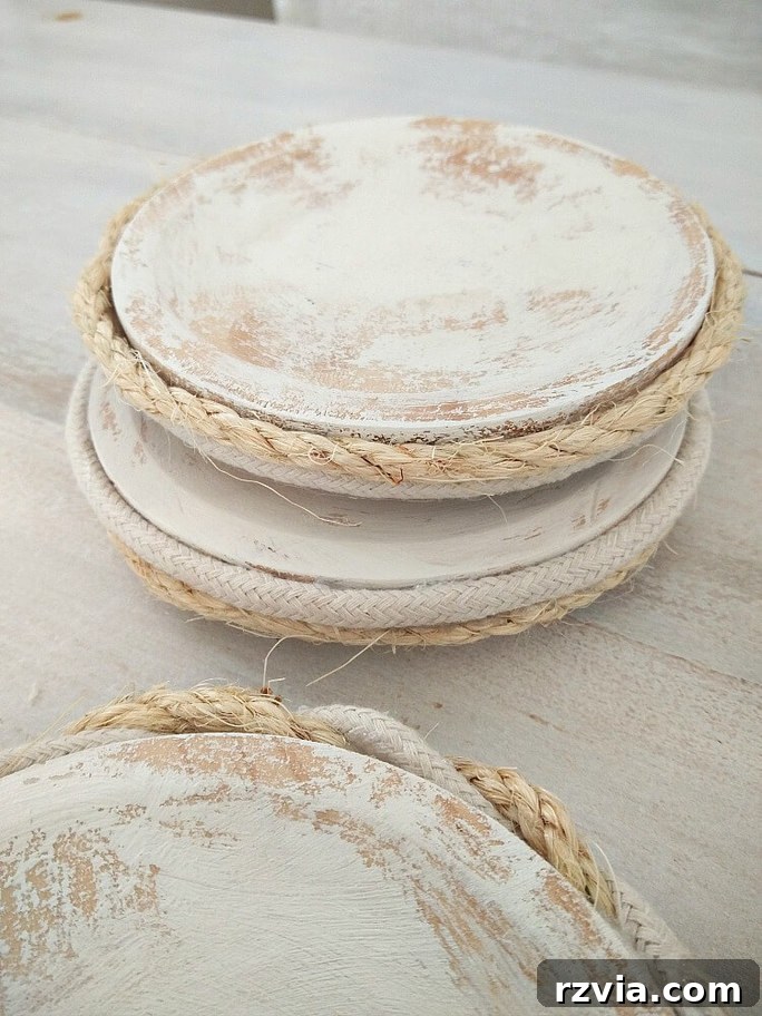 Creative DIY Presents Mom Will Adore 4 Handmade rope-wrapped wooden coasters, a rustic and practical DIY gift idea for Mother's Day.