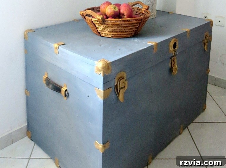 Aged to Perfection: Milk Painting a Vintage Metal Trunk 13 Close-up of the vintage trunk's painted surface, revealing soft brushstrokes and subtle color variations creating a 'cloudy' effect.
