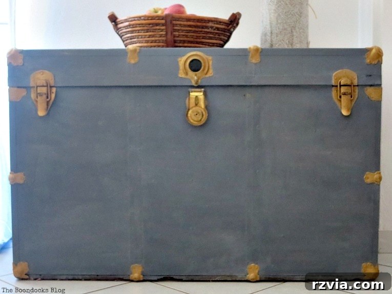 Aged to Perfection: Milk Painting a Vintage Metal Trunk 10 The fully restored vintage metal trunk, showcasing its elegant soft grey paint and polished hardware.