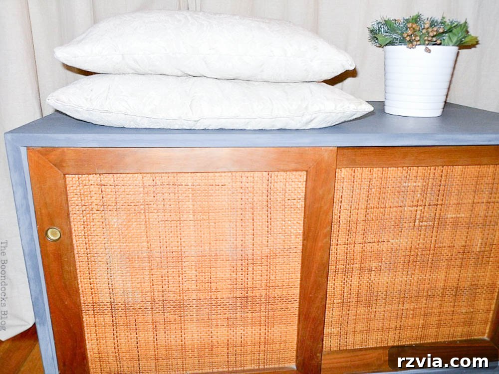 Milk Paint Revived Mid-Century Modern Sideboard 13 Angled view of the restored Mid-Century Modern sideboard, showcasing the detailed finish and revived wood doors.