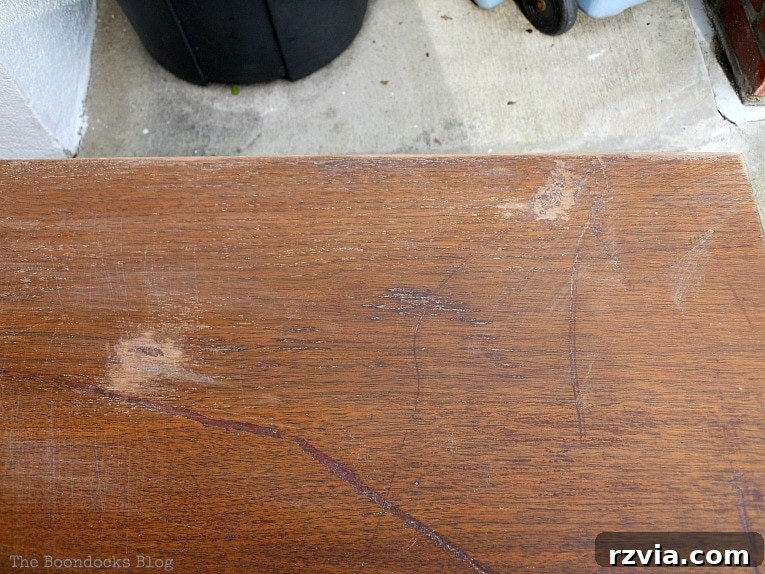 Milk Paint Revived Mid-Century Modern Sideboard 4 Close-up of the damaged top surface of the Mid-Century Modern Sideboard, showing deep scratches and imperfections.