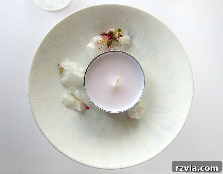 Sweet Spring Stages Repurposed Cordial Glasses 11 Almond flowers and a tealight sitting on the painted saucer.