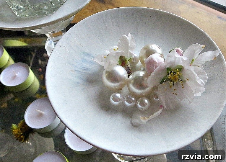 Sweet Spring Stages Repurposed Cordial Glasses 16 Top view of the painted saucer with a flower and faux pearls placed in it.