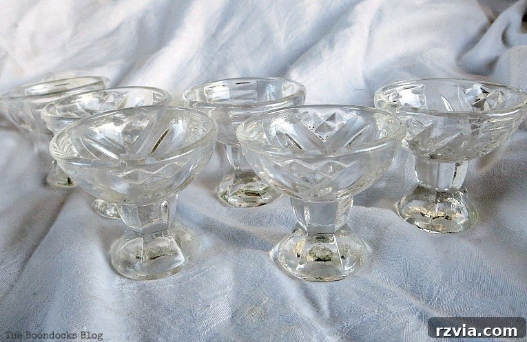 Sweet Spring Stages Repurposed Cordial Glasses 6 Six cordial glasses sitting on a white sheet.