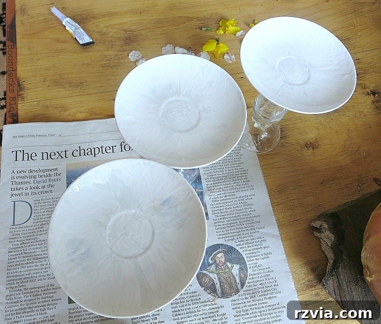 Sweet Spring Stages Repurposed Cordial Glasses 9 Painting the saucers with white paint.